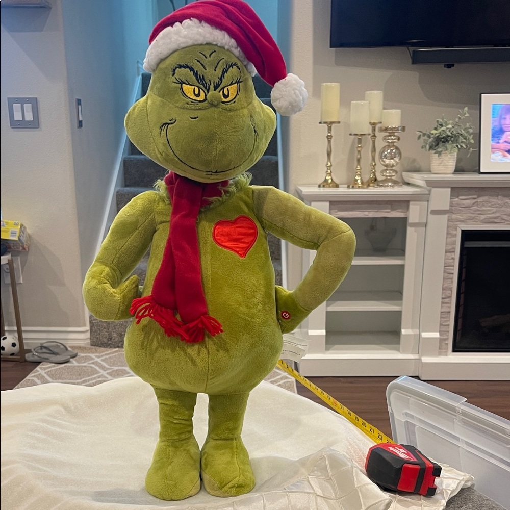Green Grinch Plush with Santa Hat and Scarf with Herat that lights up